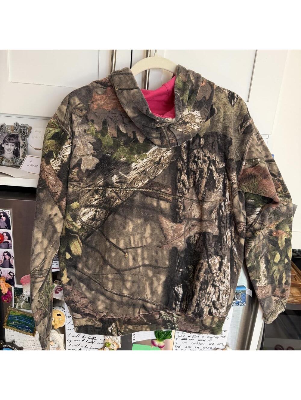 Mossy Oak camo hoodie with tree bark and leaf patterns